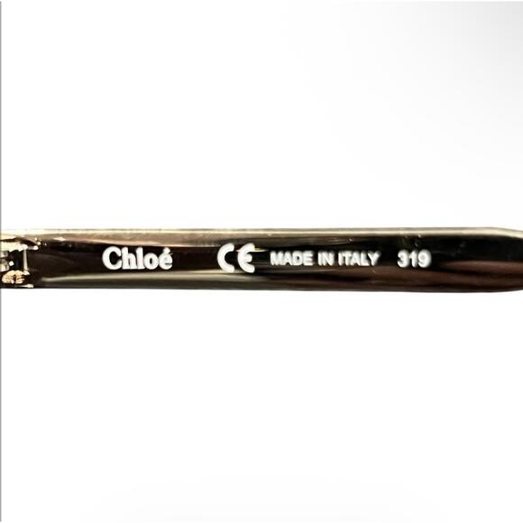 Chloé CE712S sunglasses feature a distinct brown and gold oversized round frame main image 13